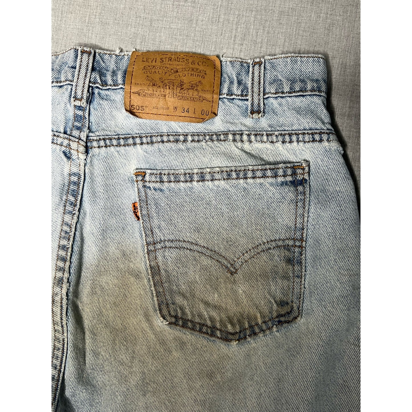 Vintage Levi’s 505 Orange Tab Light Wash Distressed Regular Fit Jean Shorts 34