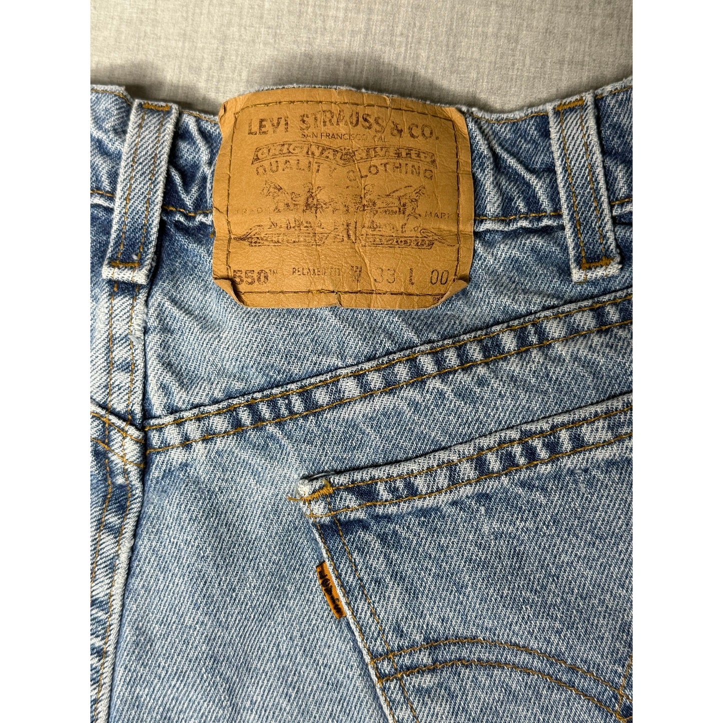 Vintage 90s Levi’s 550 Relaxed Fit Orange Tab Denim Jean Shorts 33